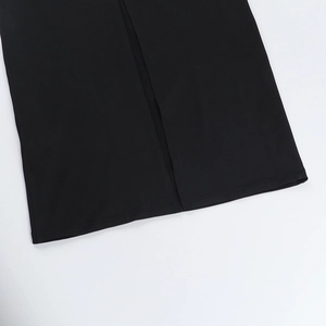 Detailed view of back slit hem on black lace sexy dress with high-quality knit texture