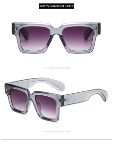 Detail of square grey sunglasses with golden arrow rivets and gradient purple lenses