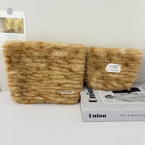 Set of two orange leopard print plush makeup bags in large and small sizes