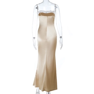 Close-up of champagne satin maxi dress featuring intricate lace patchwork on the back