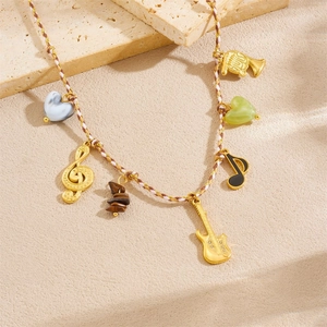 Bohemian musical theme necklace with guitar, note pendants and colorful woven rope