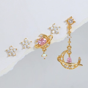 Pink heart zircon and celestial gold earring set featuring moon and star elements