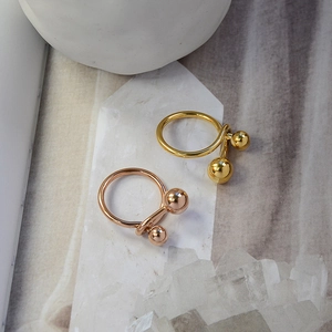 Minimalist double ball titanium steel ring in gold and rose gold with polished finish