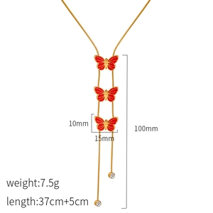 Golden butterfly necklace with red enamel pendants and sparkling small crystal drops