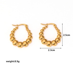 Detail of gold beaded hoop earrings showing a 2.5cm diameter and 8.9g weight specifications