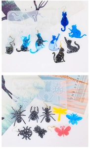 Macro detail of silicone animal molds with finished resin butterfly and bee earrings