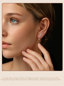 Close-up of elegant s925 silver stud earring with moissanite and hanging white pearl