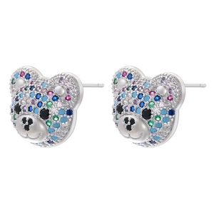 Detailed macro view of colorful rhinestone bear stud earrings in a symmetrical layout