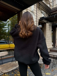 Women's warm black sherpa fleece jacket with full zipper shown from the back view