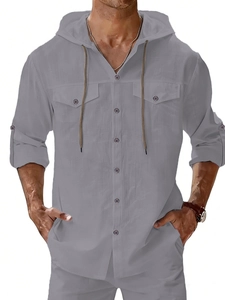 Detail view of men's grey linen hooded shirt with dual chest pockets and buttoned cuffs