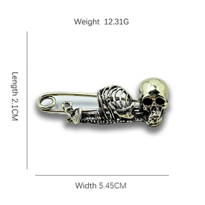 Vintage gold skull safety pin brooch in gothic punk style with size measurements