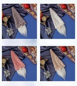 Detail of four colorful gnome wine bottle covers made of non-woven fabric for Christmas
