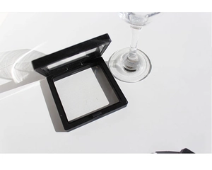 Detail view of a black square jewelry box with transparent PE film showing inner content