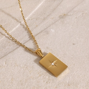 18k gold plated stainless steel layered necklace with a starburst square pendant