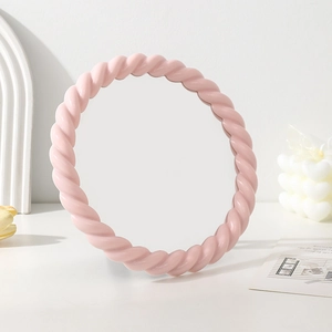 Pink braided round makeup mirror with adjustable angle for desktop vanity decor