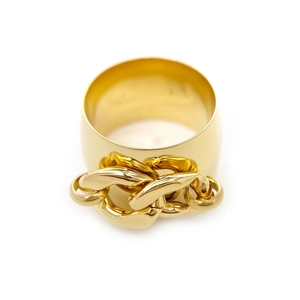Macro view of wide gold chain ring showing industrial metal texture and details