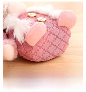 Detail view of pink sequin gnome with diamond weave fabric and golden buttons