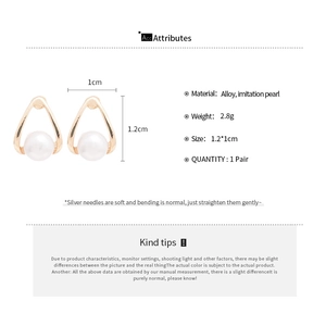 Detail showing dimensions of 1.2x1cm for gold triangle pearl stud earrings with silver pins