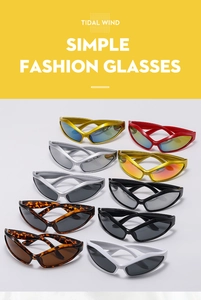 Close-up of retro wide-leg cat-eye sunglasses with metallic finish and wrap-around frame