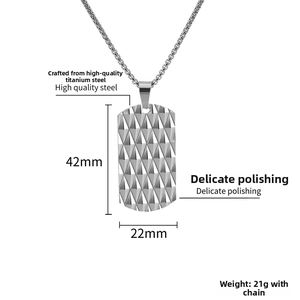 Macro detail of silver stainless steel dog tag necklace with diamond pattern textures