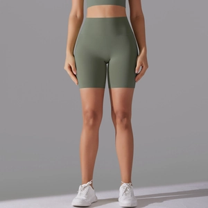 Detail view of olive green high-waisted seamless athletic shorts for yoga and fitness