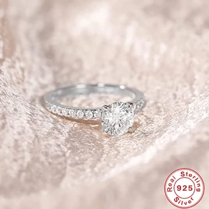 Macro shot of 925 sterling silver ring with round diamond and polished finish