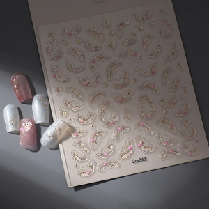Macro detail of 3D embossed nail stickers featuring gold stars and pink moons
