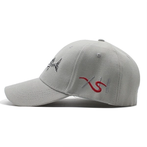 Detail view of 3D fish bone embroidery and grey cotton twill fabric on baseball cap