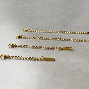 Four gold stainless steel extension chains with lobster clasps for DIY necklace making