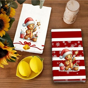 Microfiber Christmas kitchen towels featuring gingerbread prints on wooden table decor