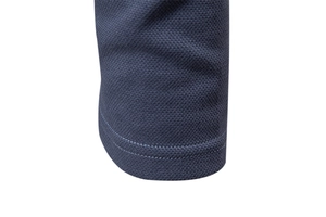 Macro view of dark blue honeycomb breathable mesh fabric with double stitching detail