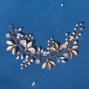 Handmade gold pearl hair vine with purple crystal flowers for bridal hair styling