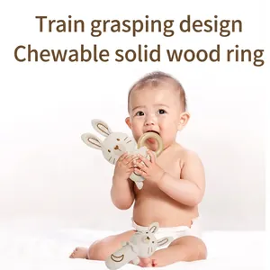 Organic cotton baby bunny rattle with natural wood ring for teething and grip training