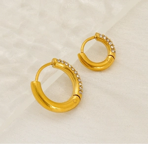 Macro shot of 18K gold plated stainless steel hoop earrings with sparkling zircon stones
