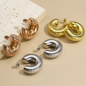 Three pairs of twisted C-shape hollow earrings in gold, silver, and rose gold finish
