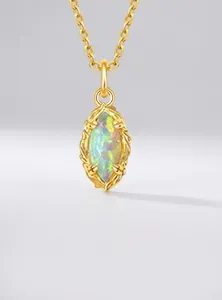 Macro shot of marquise opal pendant with vintage striped gold lace edge on S925 silver chain