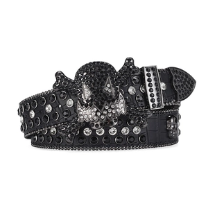 Black rhinestone belt with gothic skull buckle and shimmering studs on embossed leather