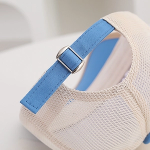 Detail of adjustable blue strap and metal buckle on breathable mesh bear baseball cap