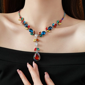 Detailed view of luxury silver-needle necklace featuring colorful pear-cut zircon crystals