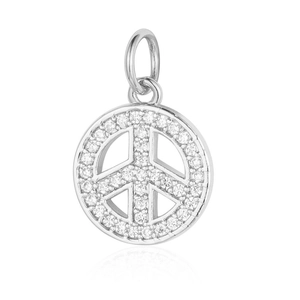 Macro view of a silver peace sign pendant with white cubic zirconia stones