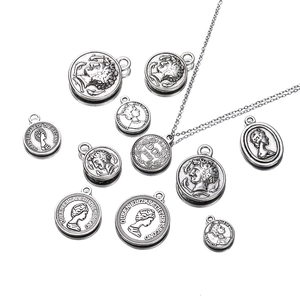 Macro detail of vintage silver coin pendants with Queen Elizabeth engraving for DIY jewelry