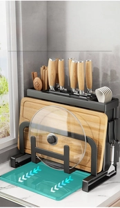 Detail view of kitchen organizer with knife block, cutting board stand, and drip tray