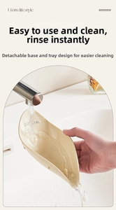 Close-up of a leaf-shaped UFORU soap dish showing the detachable design and easy cleaning