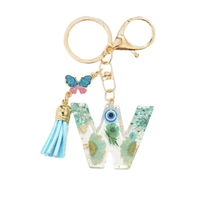Floral resin alphabet W keychain with dried flowers, evil eye charm and butterfly tassel