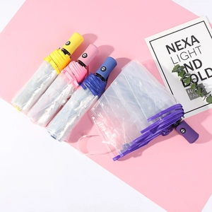 Transparent automatic folding umbrellas in yellow pink blue and purple colors
