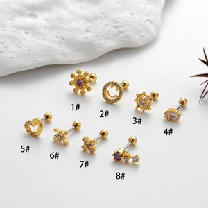 Golden stainless steel cartilage earrings set with zircon heart and sunburst designs