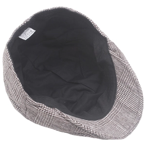 Detail view of British plaid newsboy cap showing wool blend lining and size 58cm label