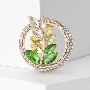 Elegant gold metal wreath brooch with colorful rhinestones and sparkling leaf pattern
