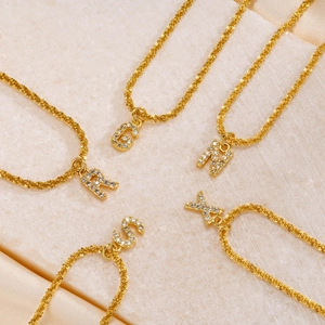 Gold plated titanium steel alphabet necklaces with sparkling crystal letter pendants