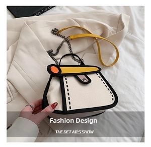 Detail of 2D cartoon style canvas bag with bold black outlines and metal chain strap